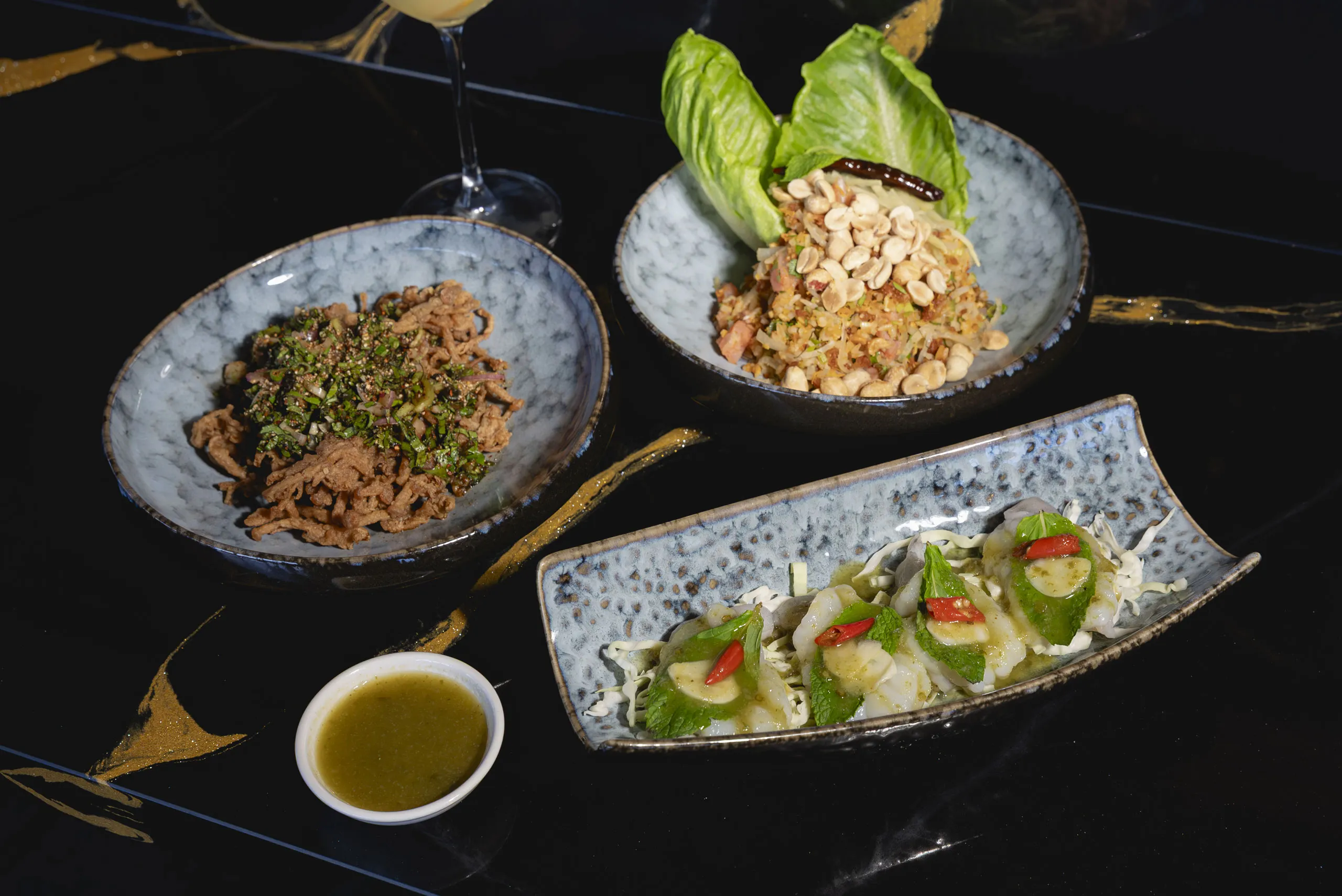 A table of dishes at Amata